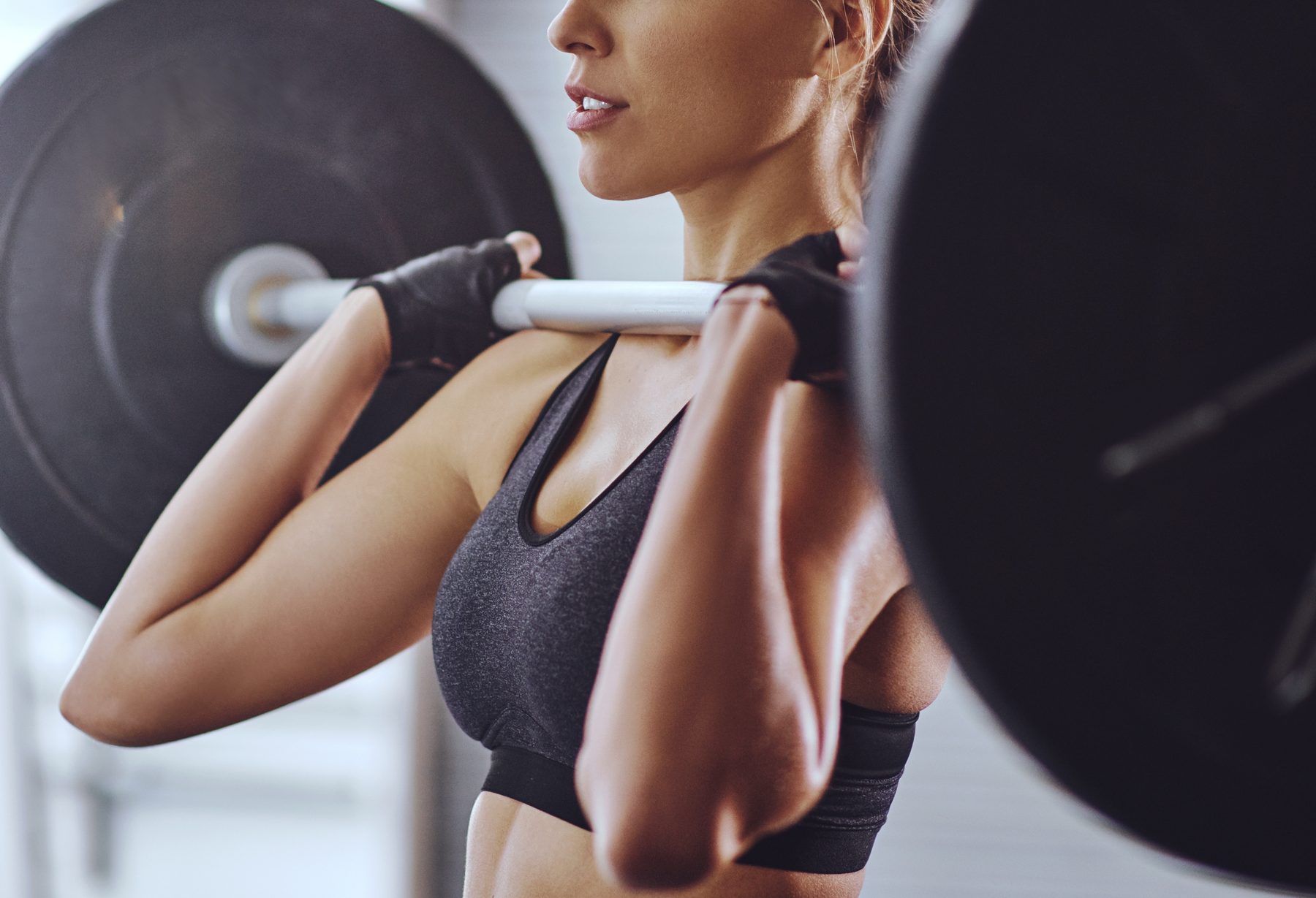 Woman front-squatting a barbell