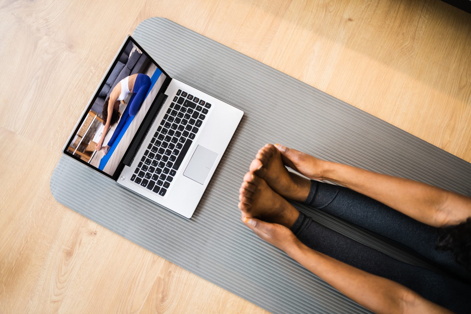 Laptop and mat set up for an online coaching session